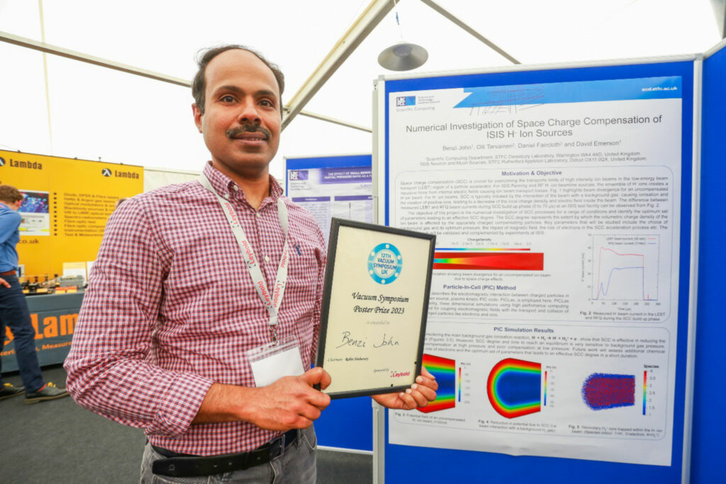 Benzi John receiving the poster session prize