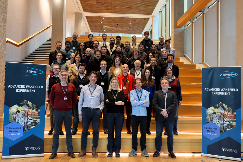 A group of people standing on stairs, posing for a photo.