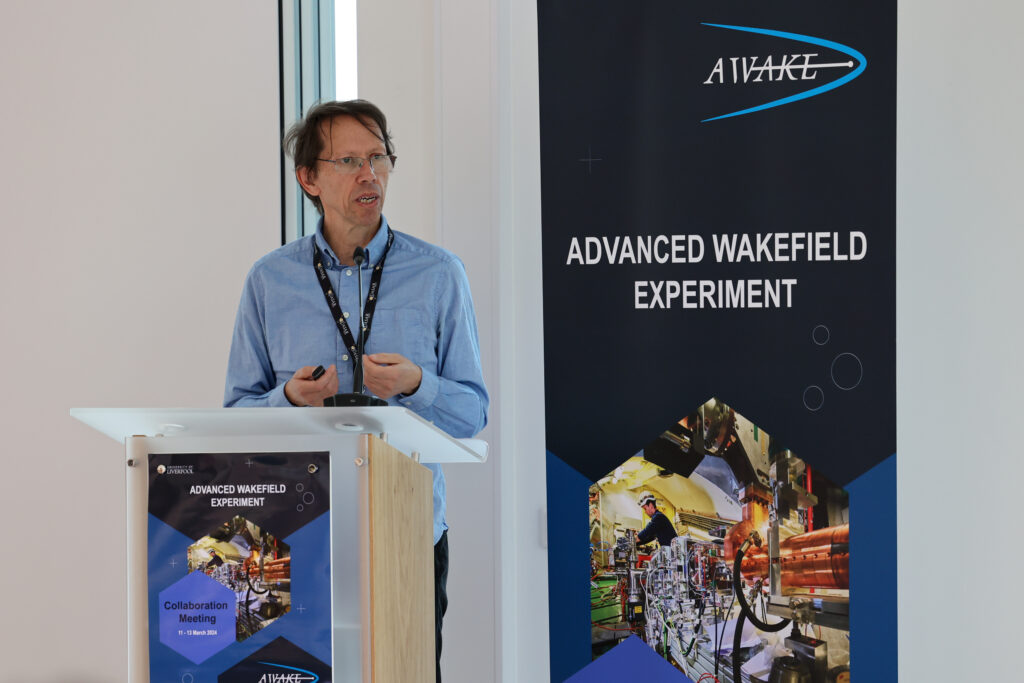A person standing at a podium and presenting a talk.