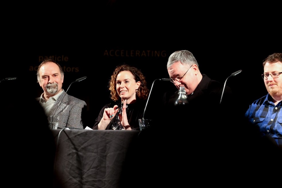 A group of smiling people sitting at a table.
