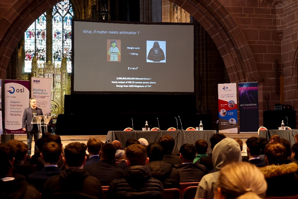 A person presenting a talk to an audience.