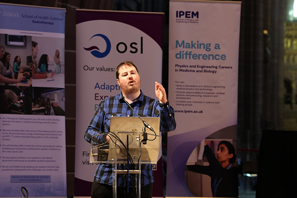 A person standing at a podium.