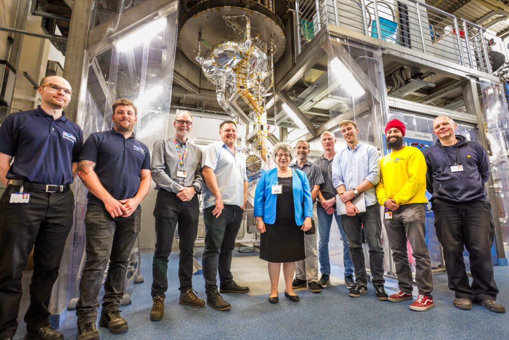 A group of people posing for a photograph in a lab.