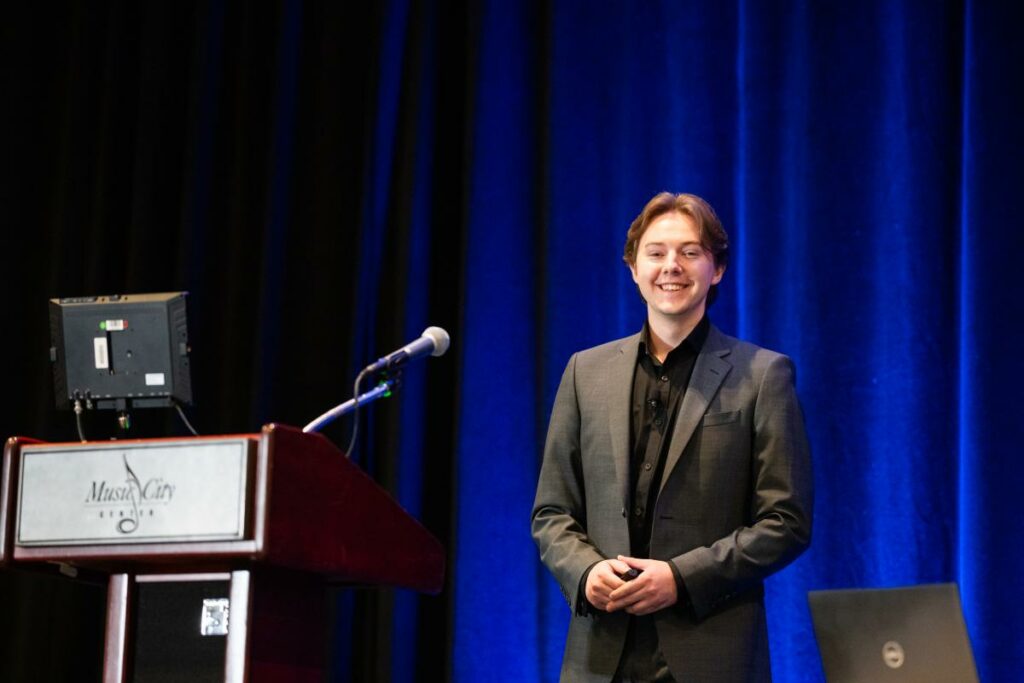 A person standing in front of a podium.