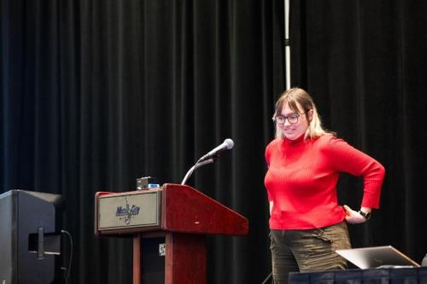 A person standing at a podium.