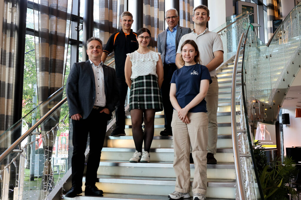 A group of people standing on stairs.
