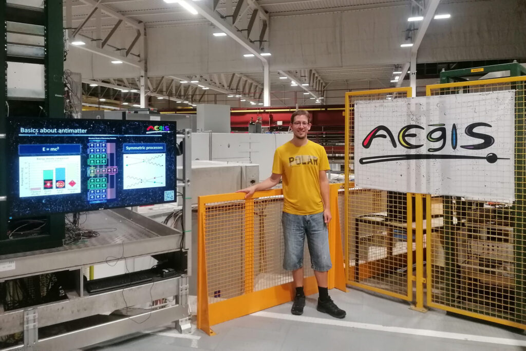A person posing for a photo in a lab.