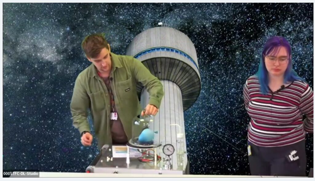 Two people preparing an experiment. In the background an image of a tower in the night sky.