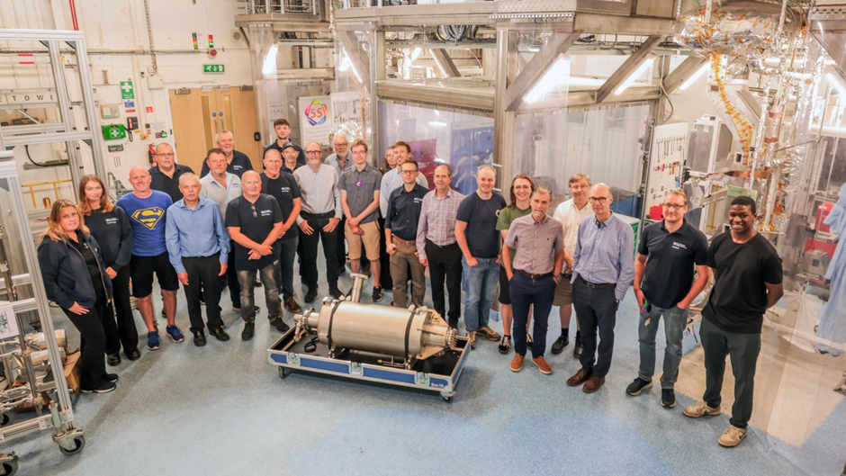 A group of people posing for a picture in a laboratory.